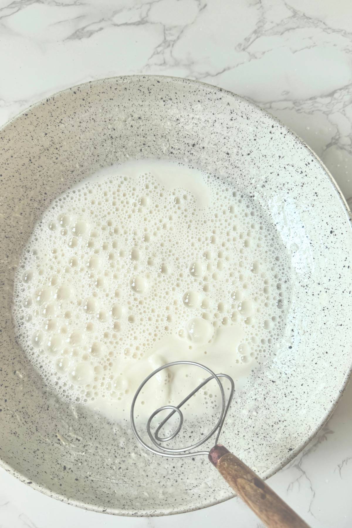 bubbly water and starter mixed together