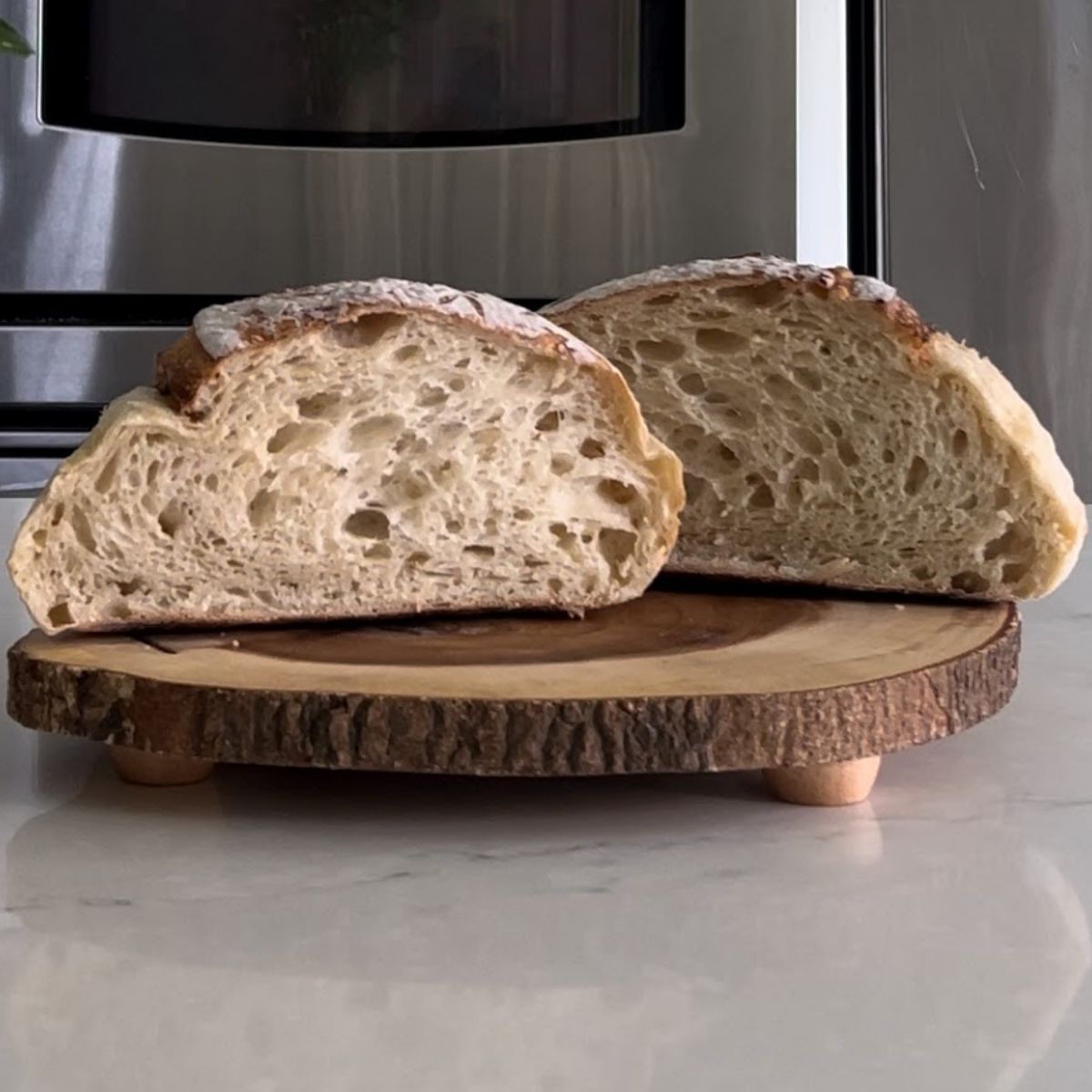 Classic loaf of Sourdough Bread sliced in half