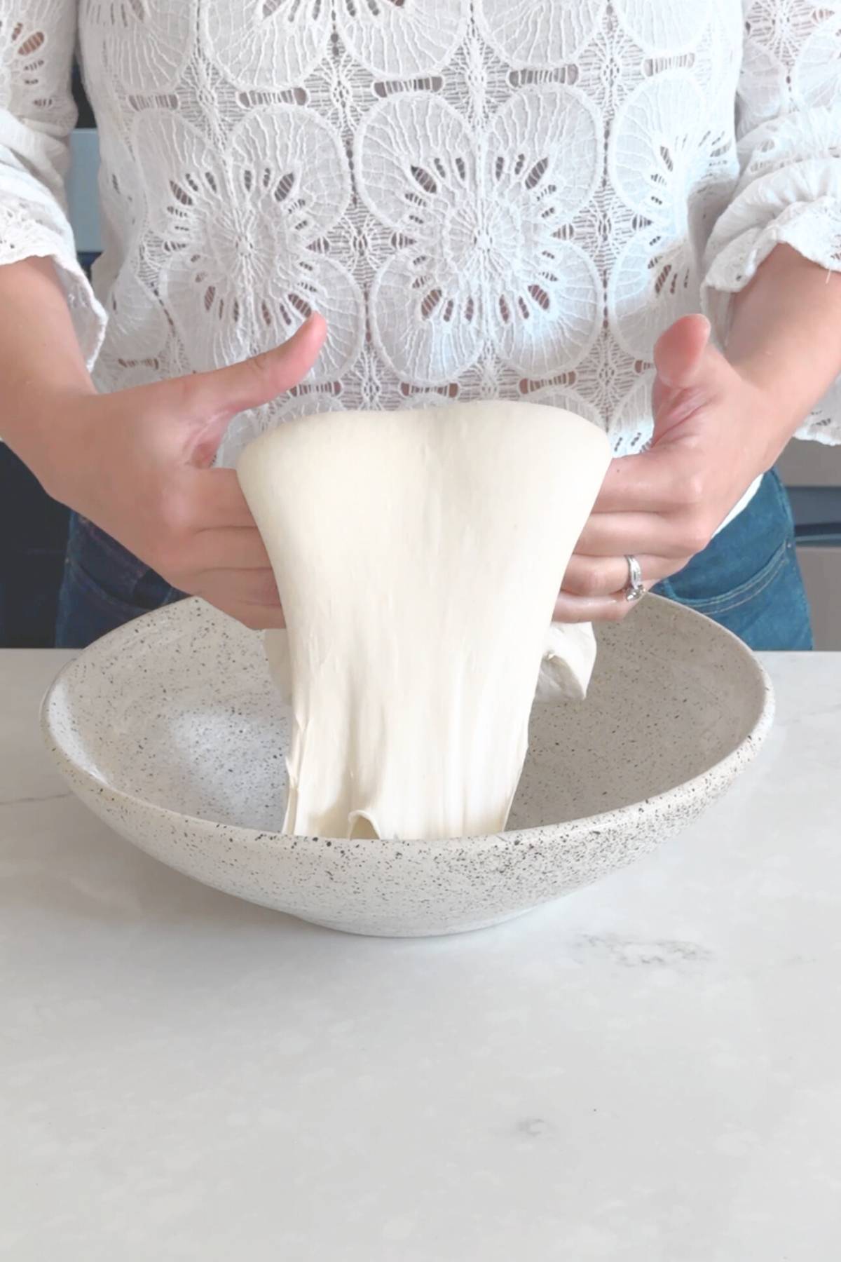 Coil fold stretching the dough upwards