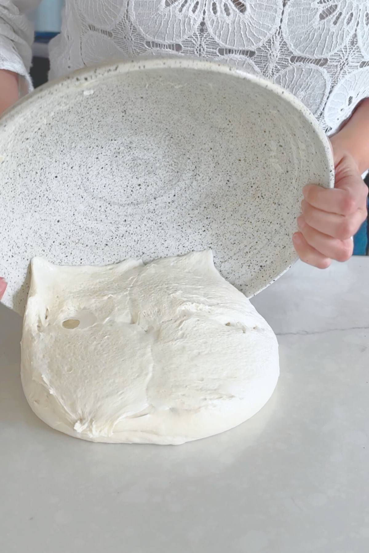 Dumping the dough on a clean surface
