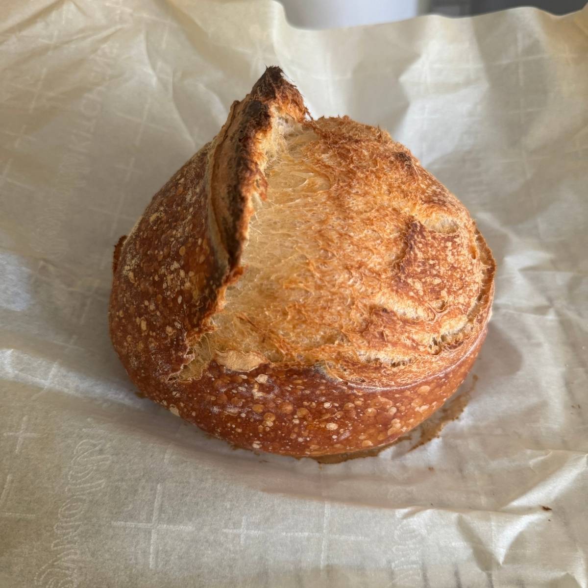 loaf of sourdough bread baked using this recipe