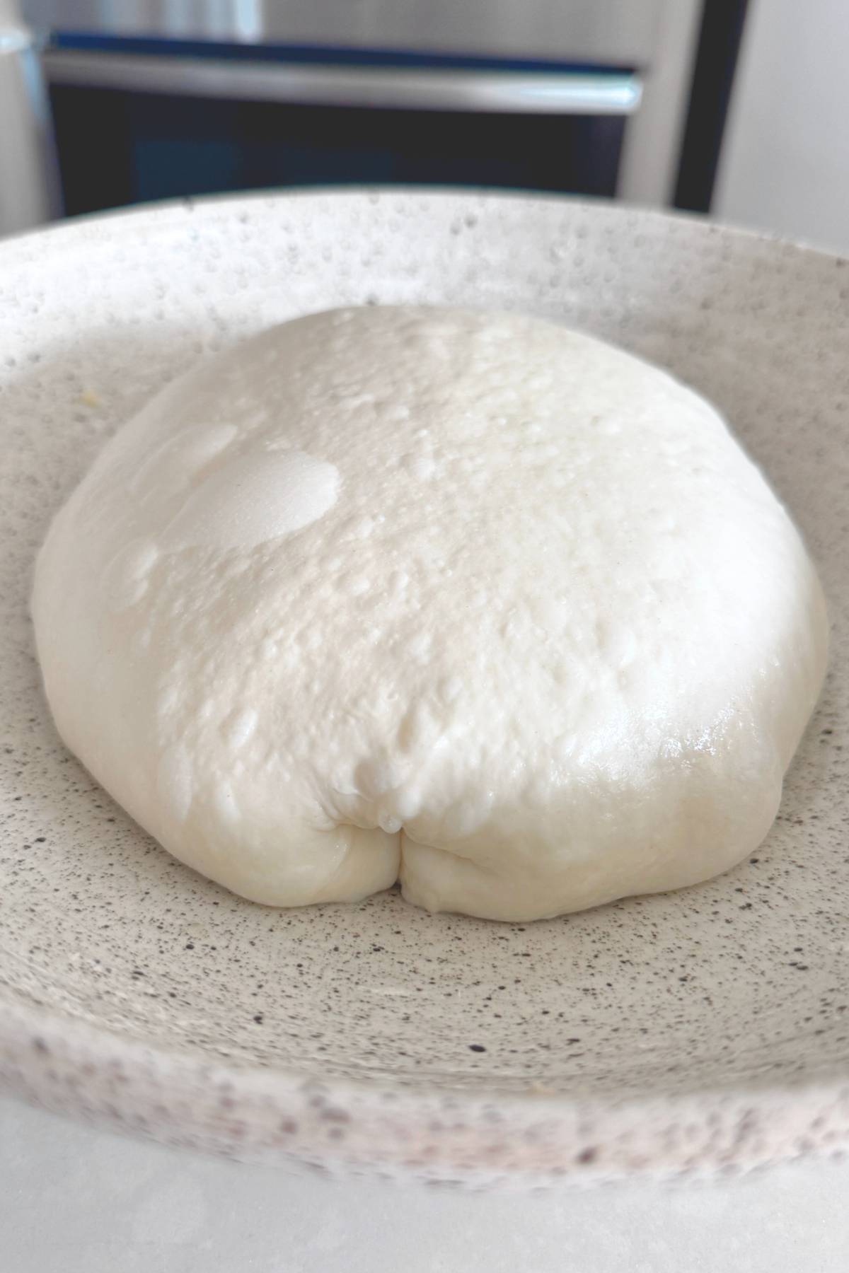 curly dough ball on a bowl