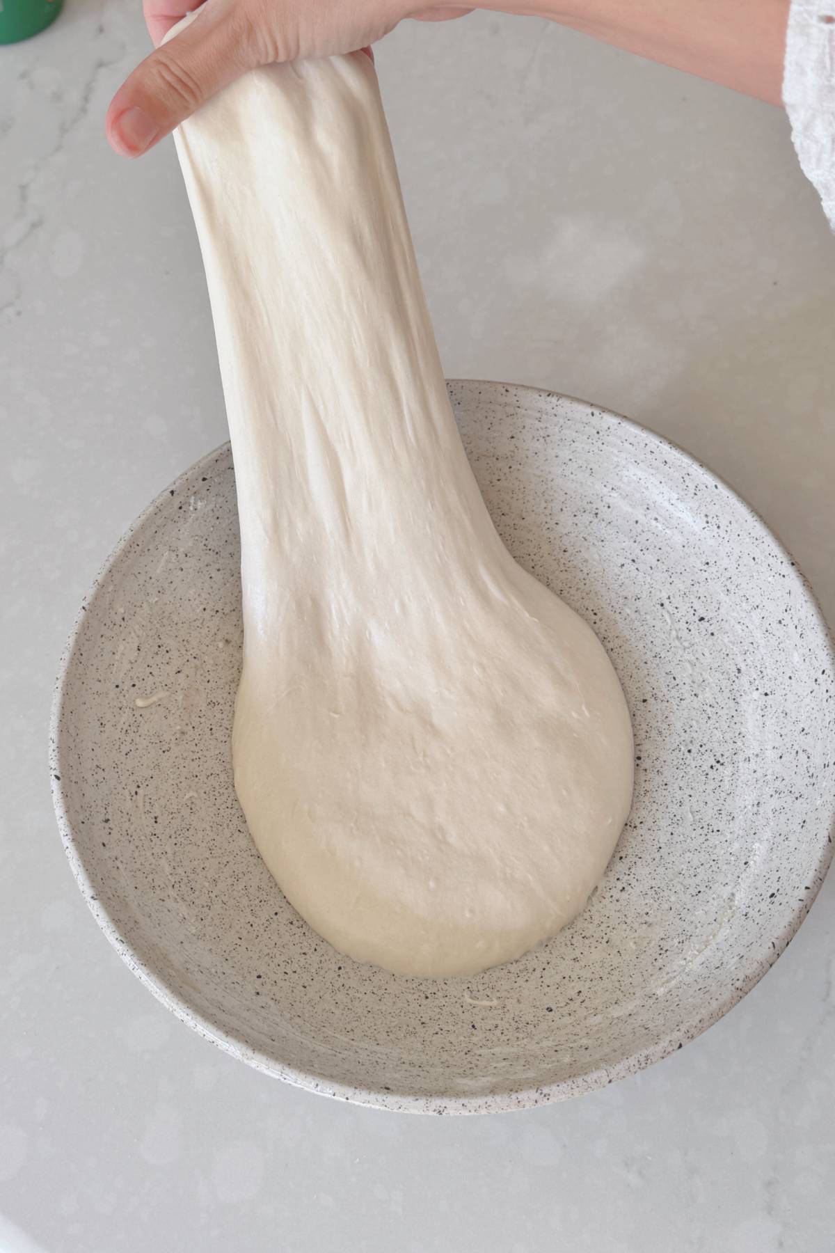 stretching the dough upwards