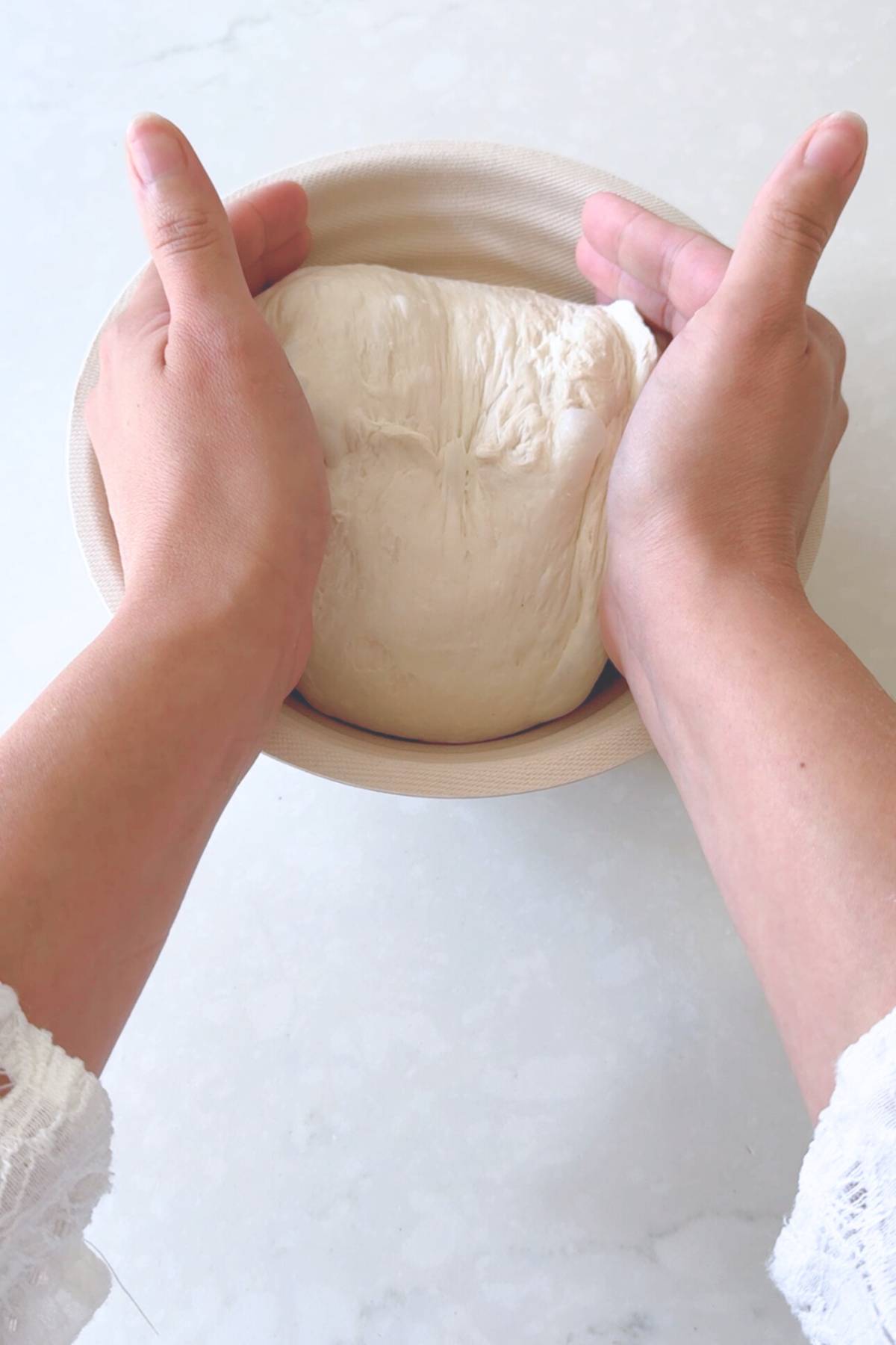 transferring the dough to the banneton