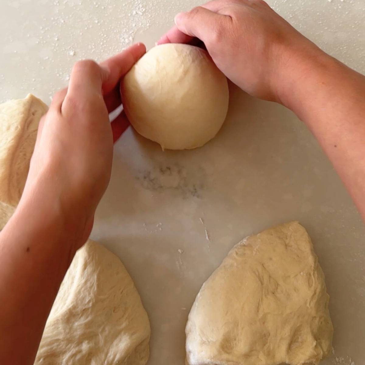 shaping pizza dough