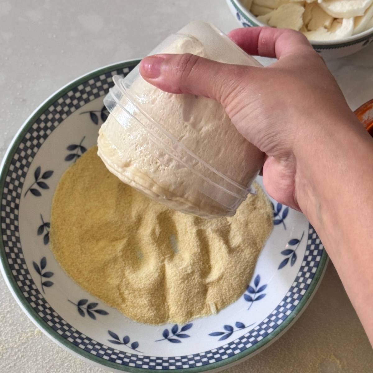 coating pizza dough on semolina