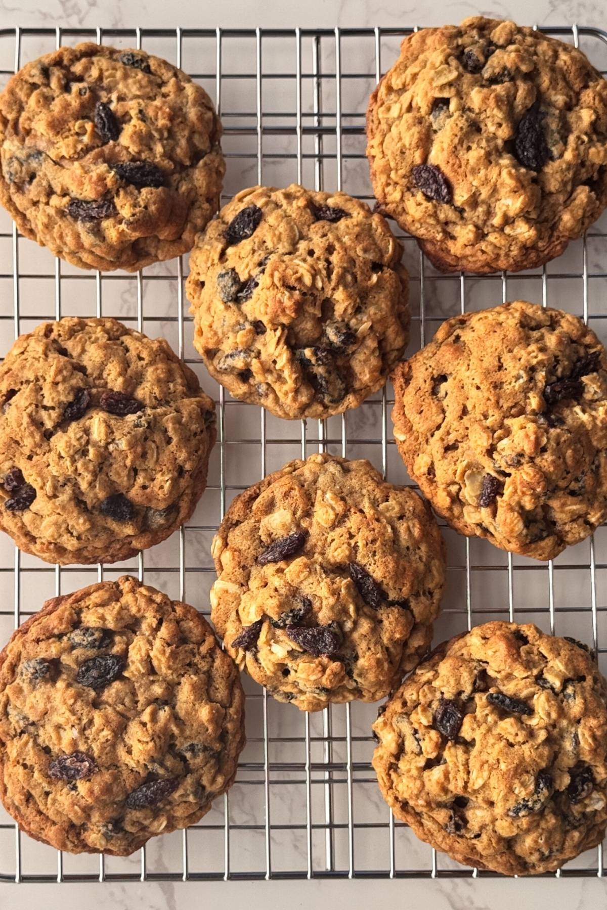 oatmeal raisin cookies on a cooling rack