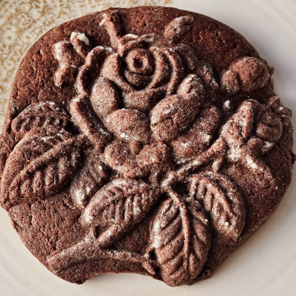 chocolate molded cookie shaped like a rose bud