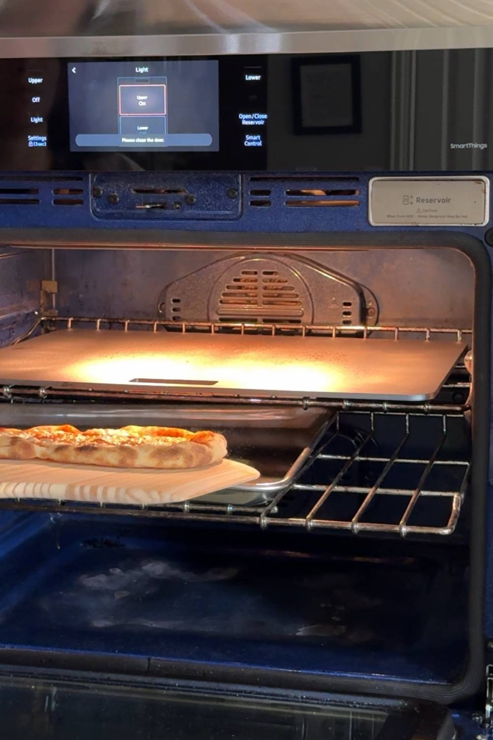 sourdough pizza dough being baked on a baking sheet