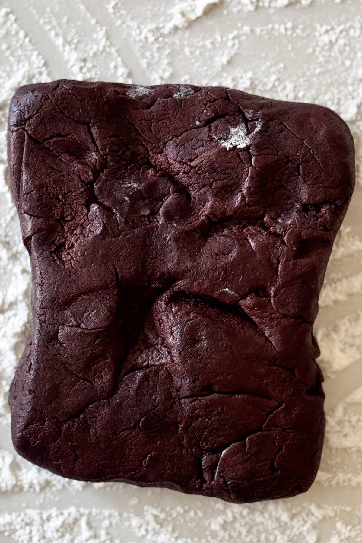 chocolate molded cookie dough on the floured counter