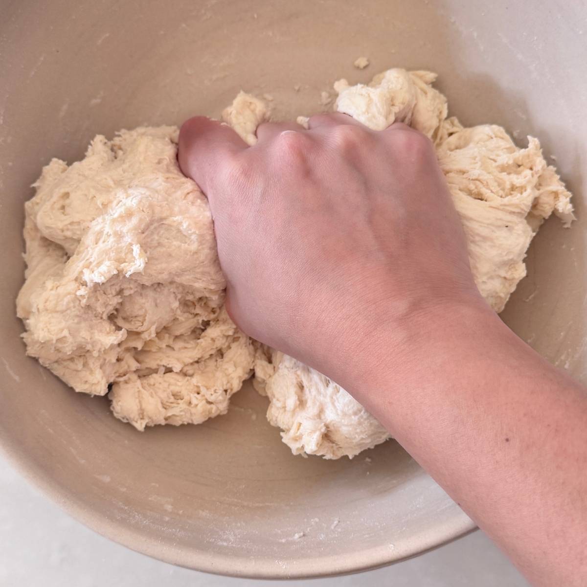 mixing pizza dough by hand