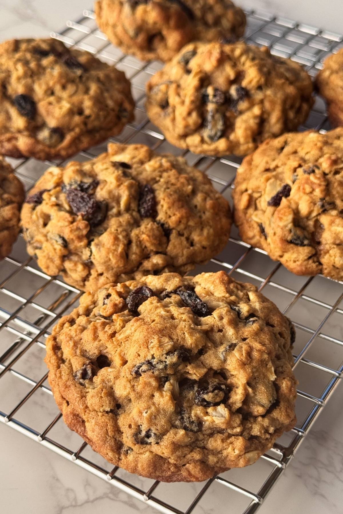oatmeal raisin cookies on a cooling rack