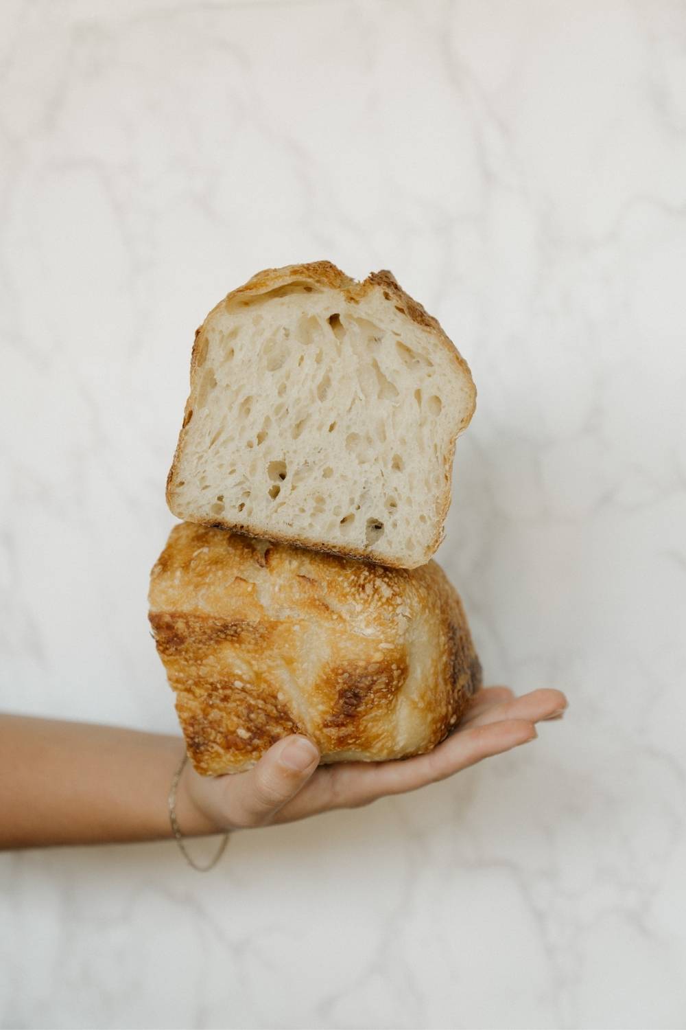loaf of bread baked using the two pan method sliced in 2