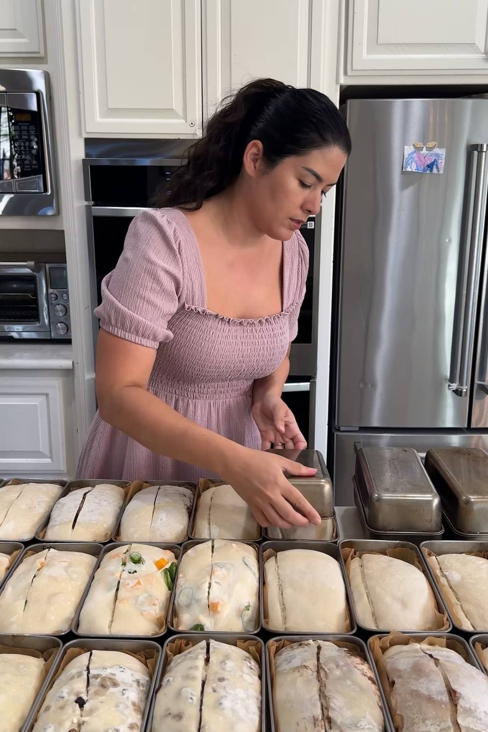 Maria covering the loaf pans with the second loaf pan for her two pan method
