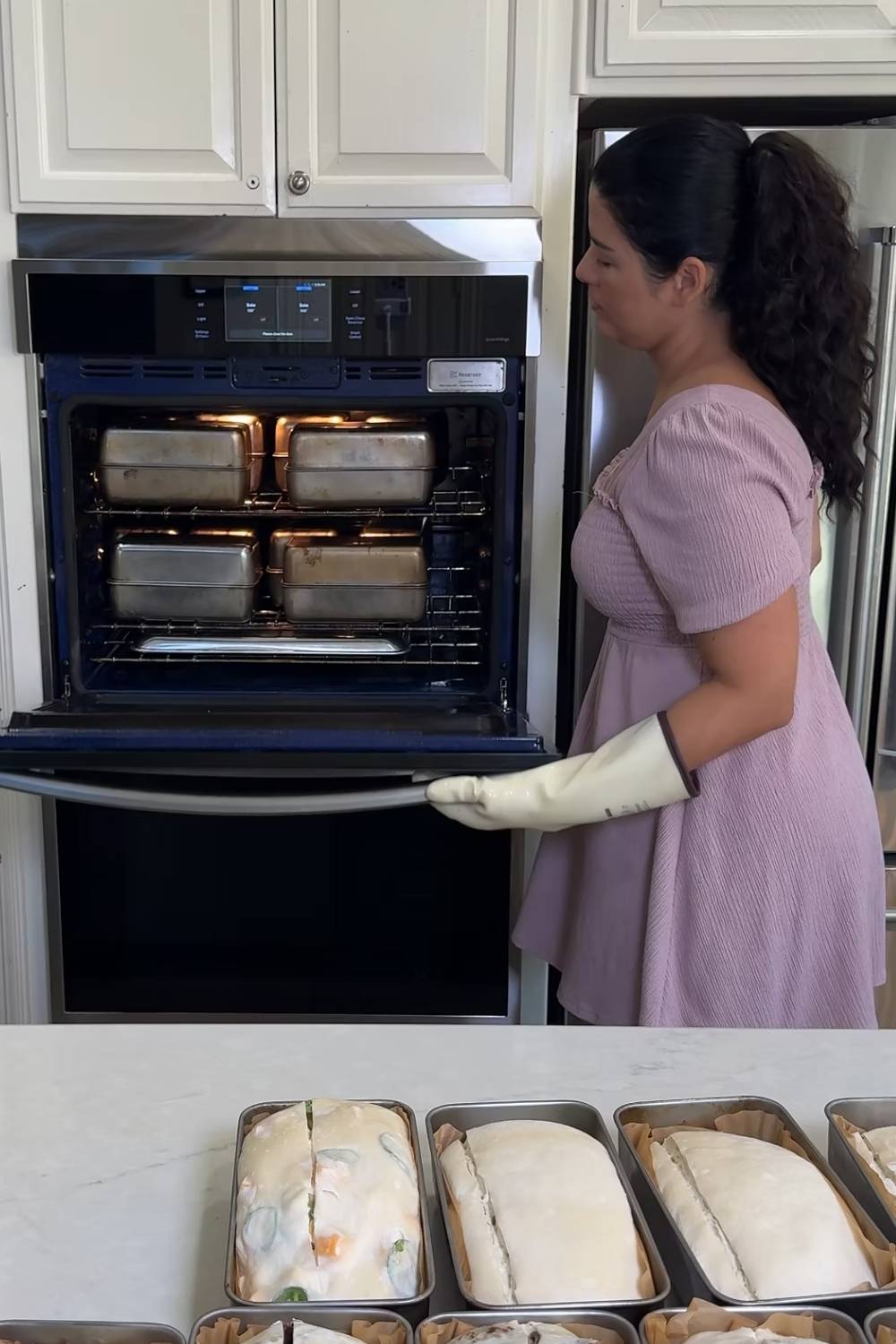 Maria baking bread using her two pan method