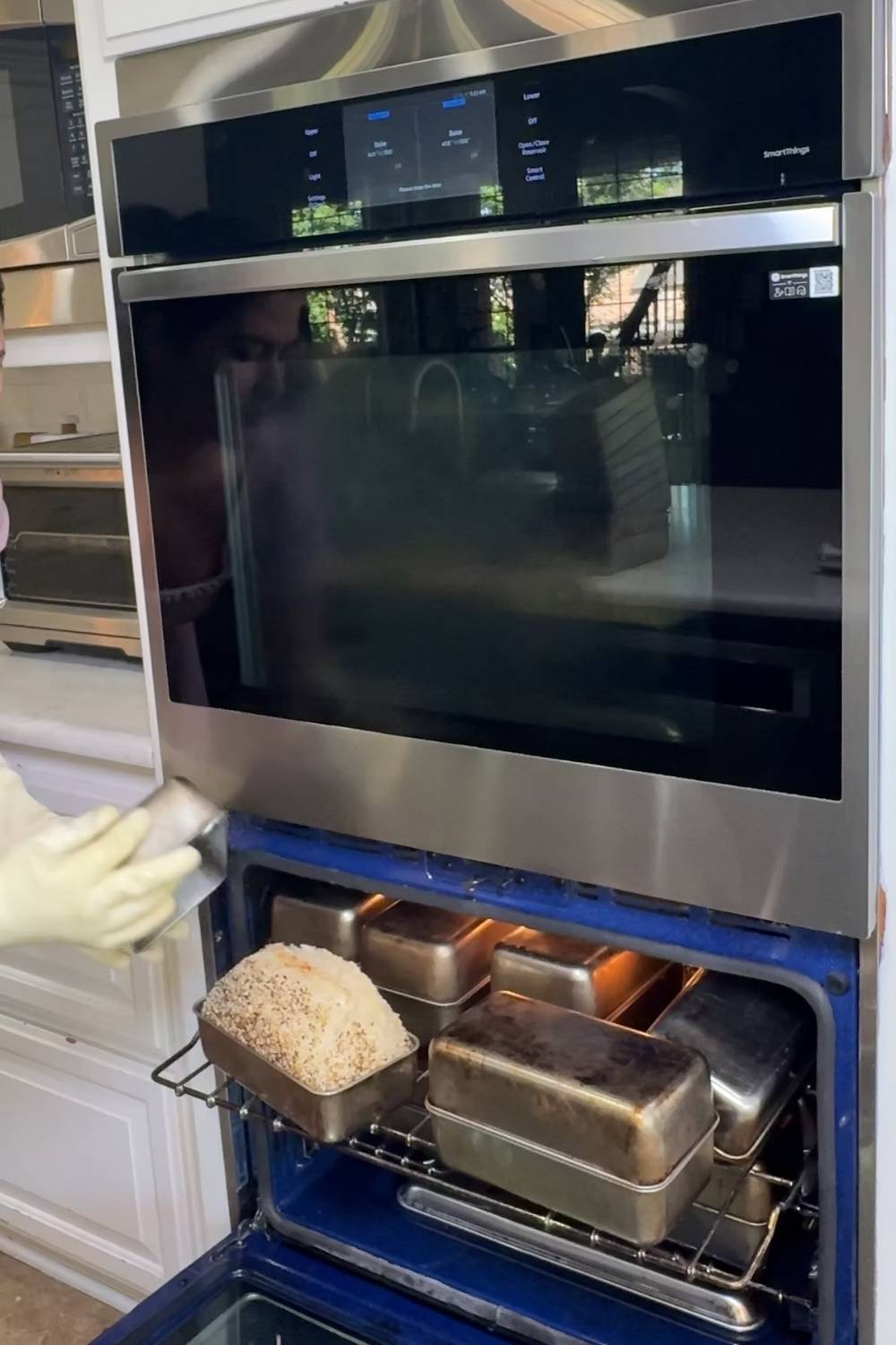 Maria removing the second loaf pan for her two pan method