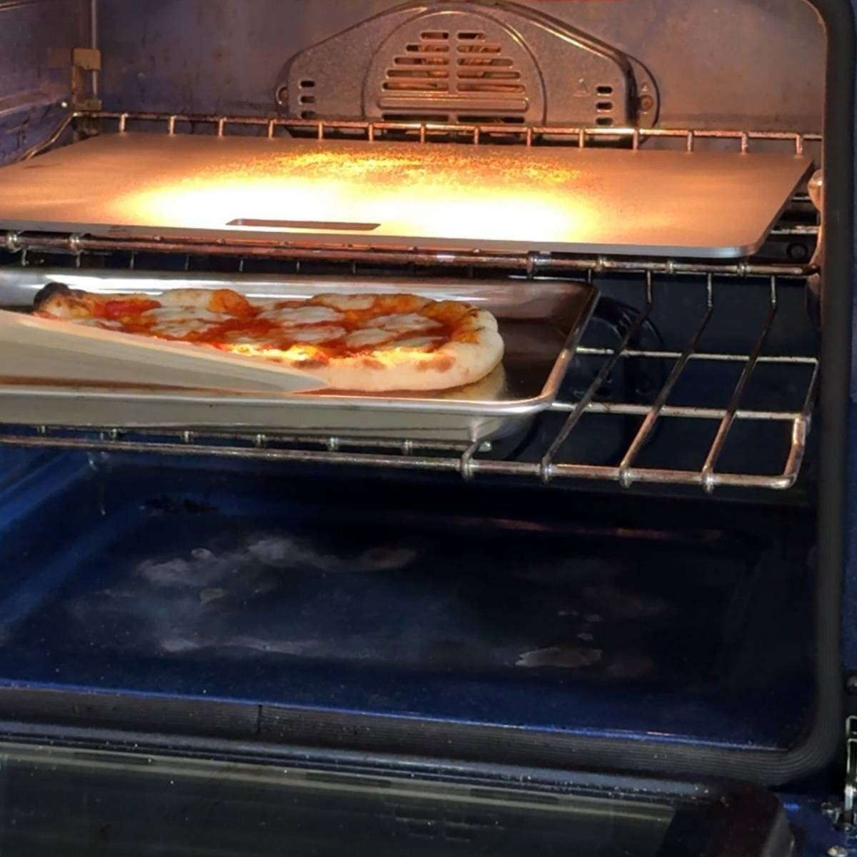 baking pizza dough in a baking sheet