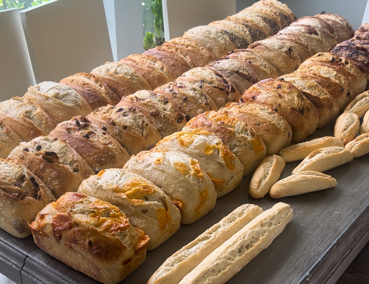 many loaves of bread on a table