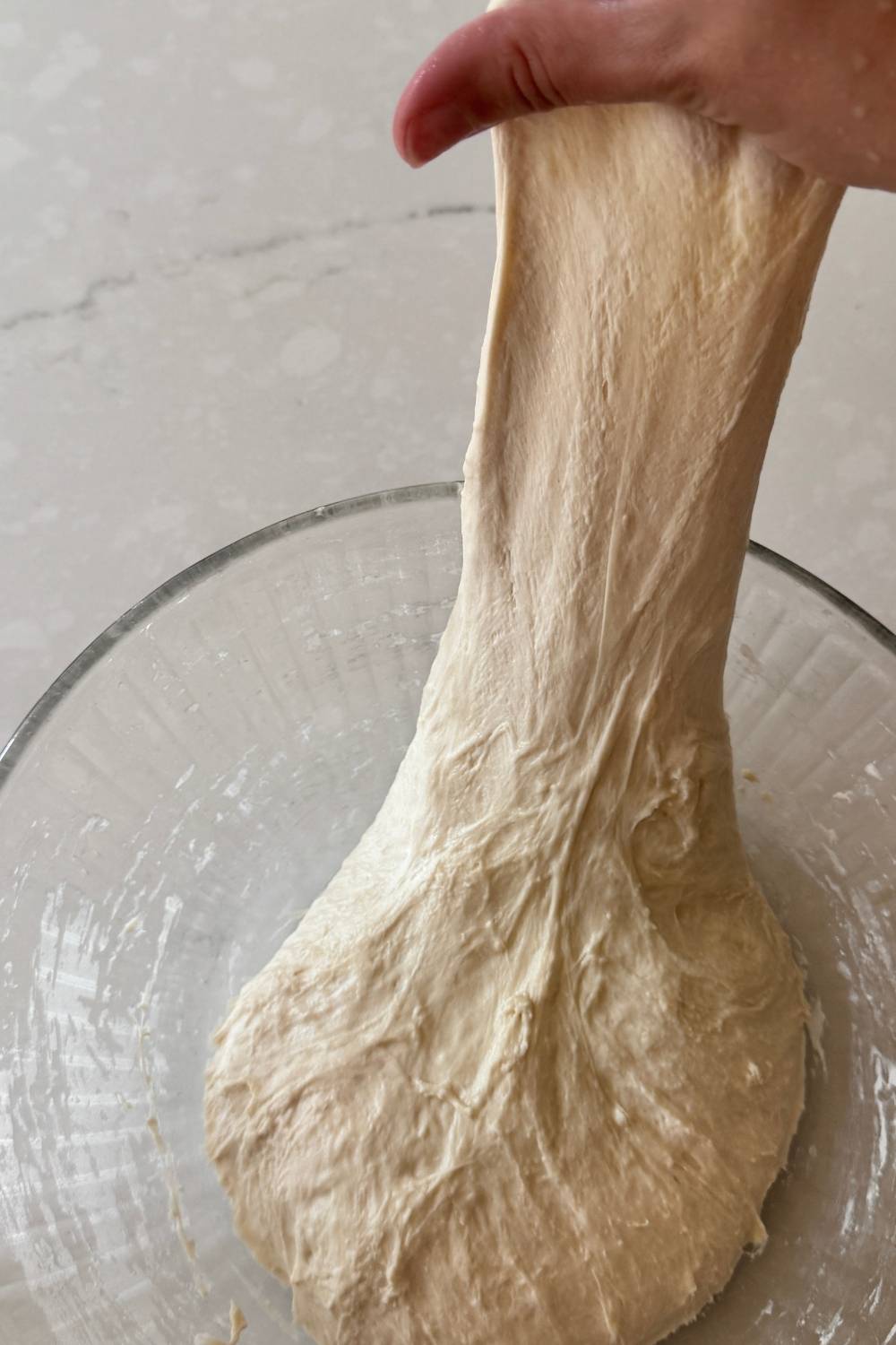 stretching pizza dough once