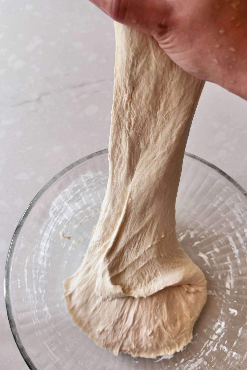 stretching pizza dough again