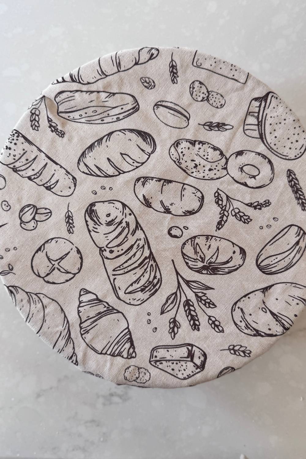 sourdough pizza dough bowl covered while it rests