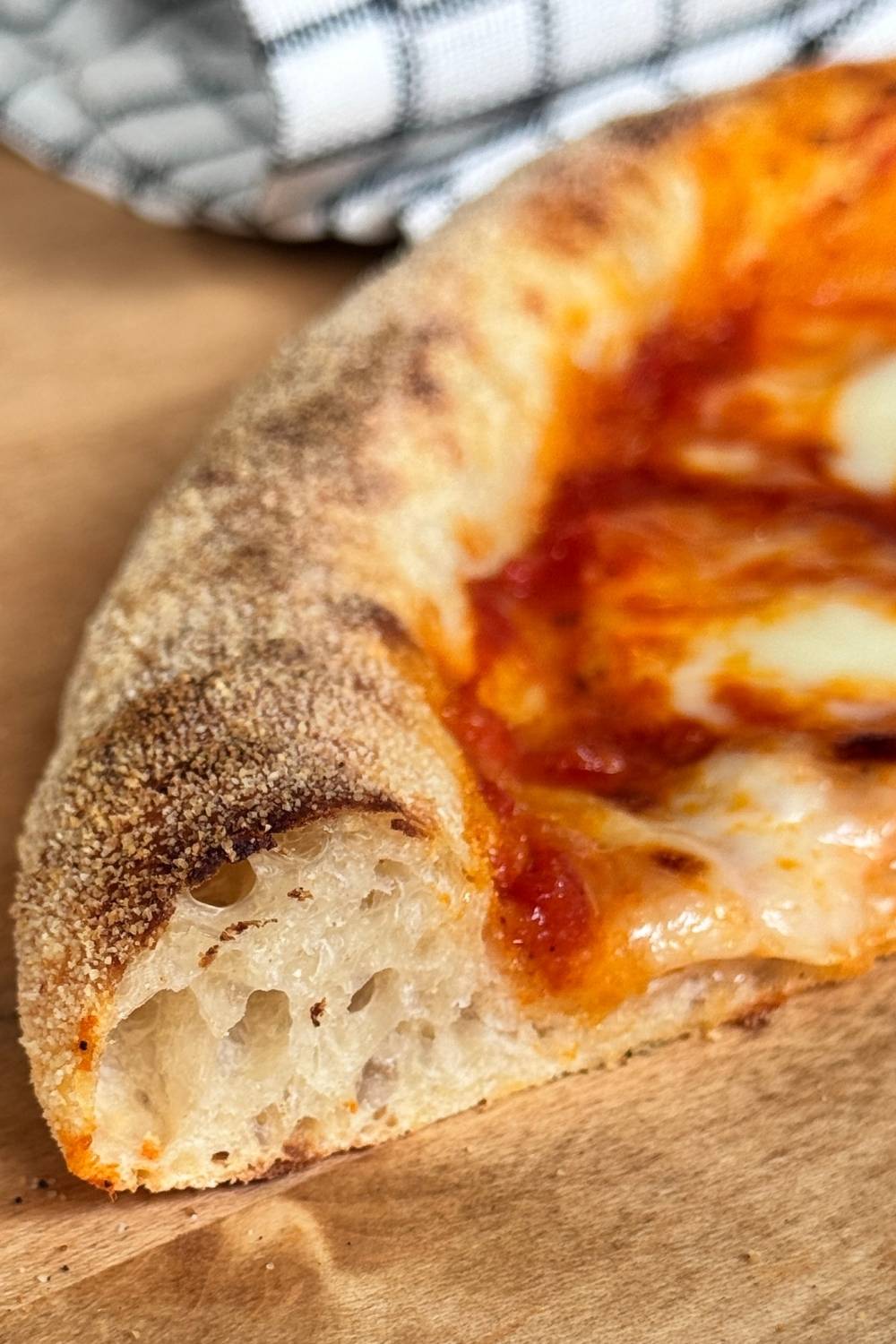 airy sourdough pizza crust with big holes