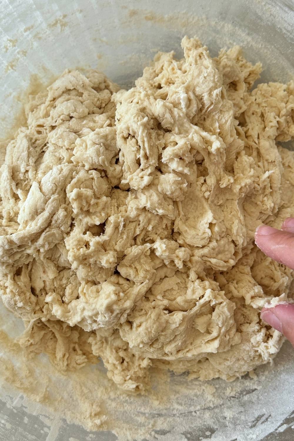 pizza dough after it was  mixed using a dough whisk until no dry spots remain