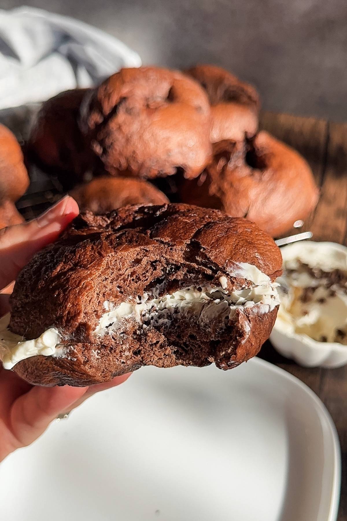 a bite of chocolate bagels with cream cheese