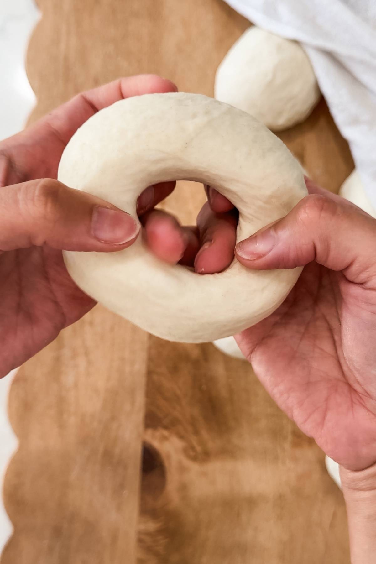poking a hole and shaping bagels
