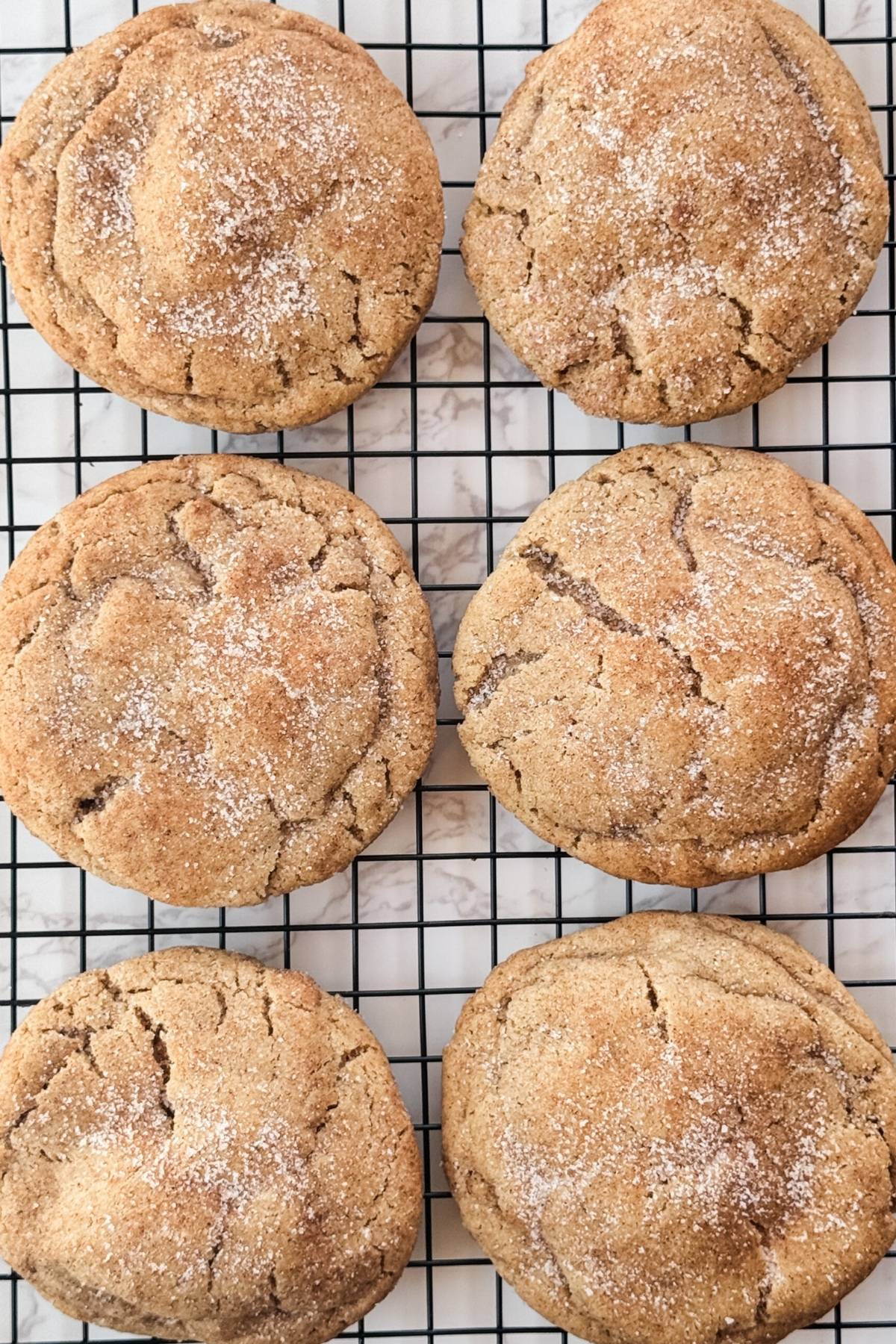 snickerdoodle cookies on a cooling rack