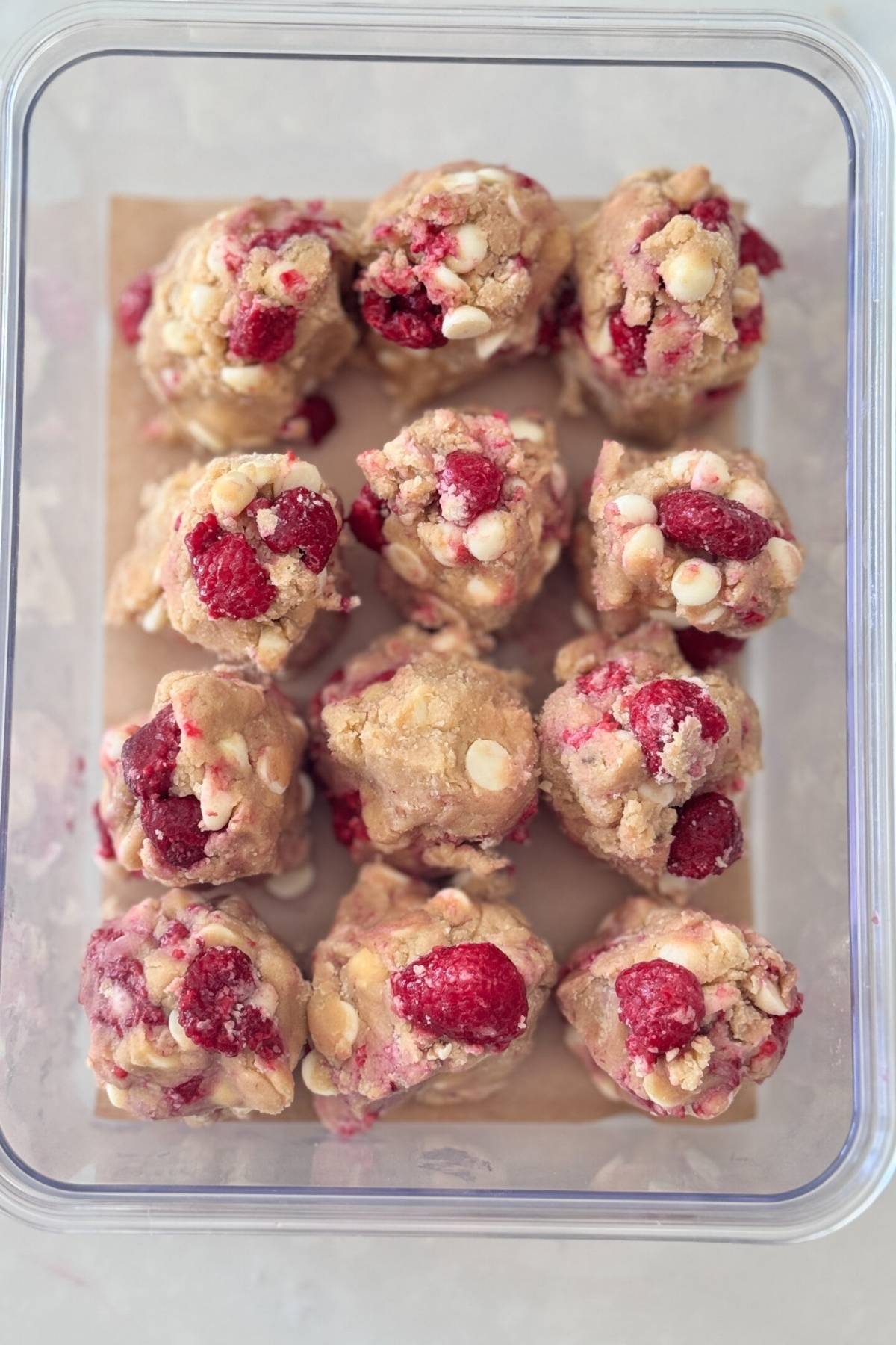 white chocolate raspberry cookie dough shaped ready to be chilled