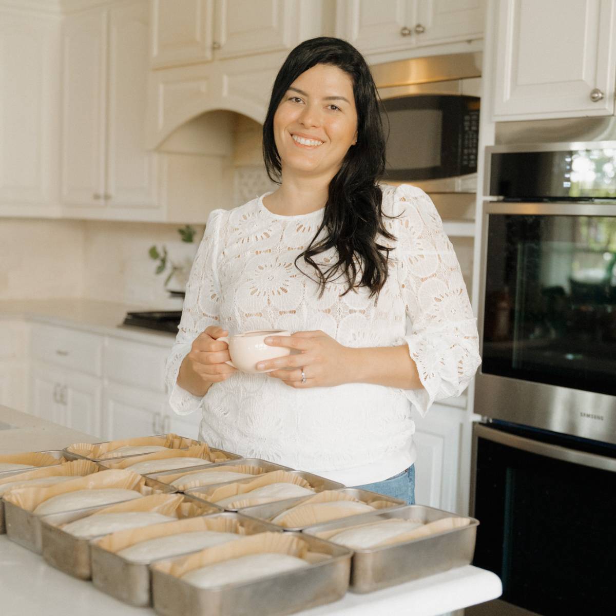 maria baradell and bread dough in loaf pans