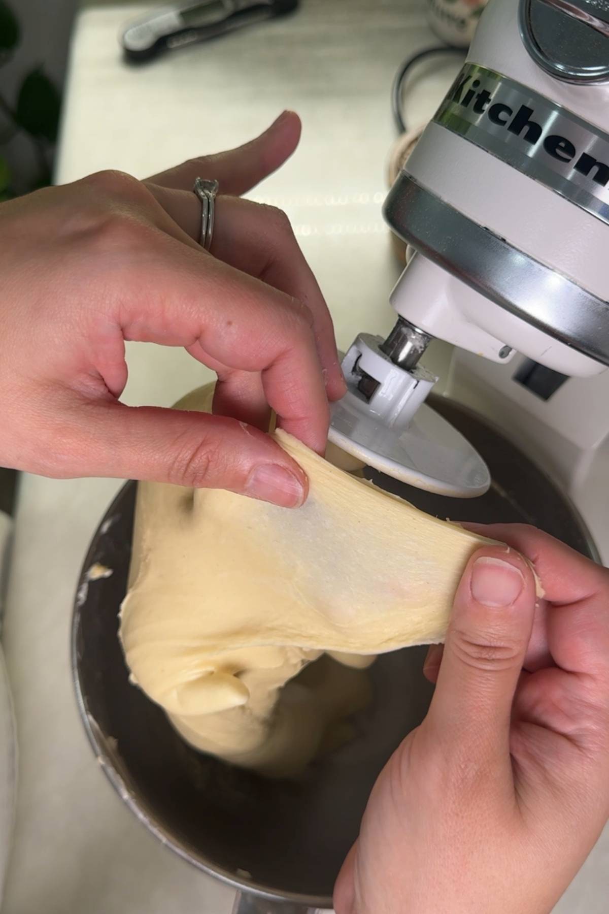 performing the window pane test on the dough