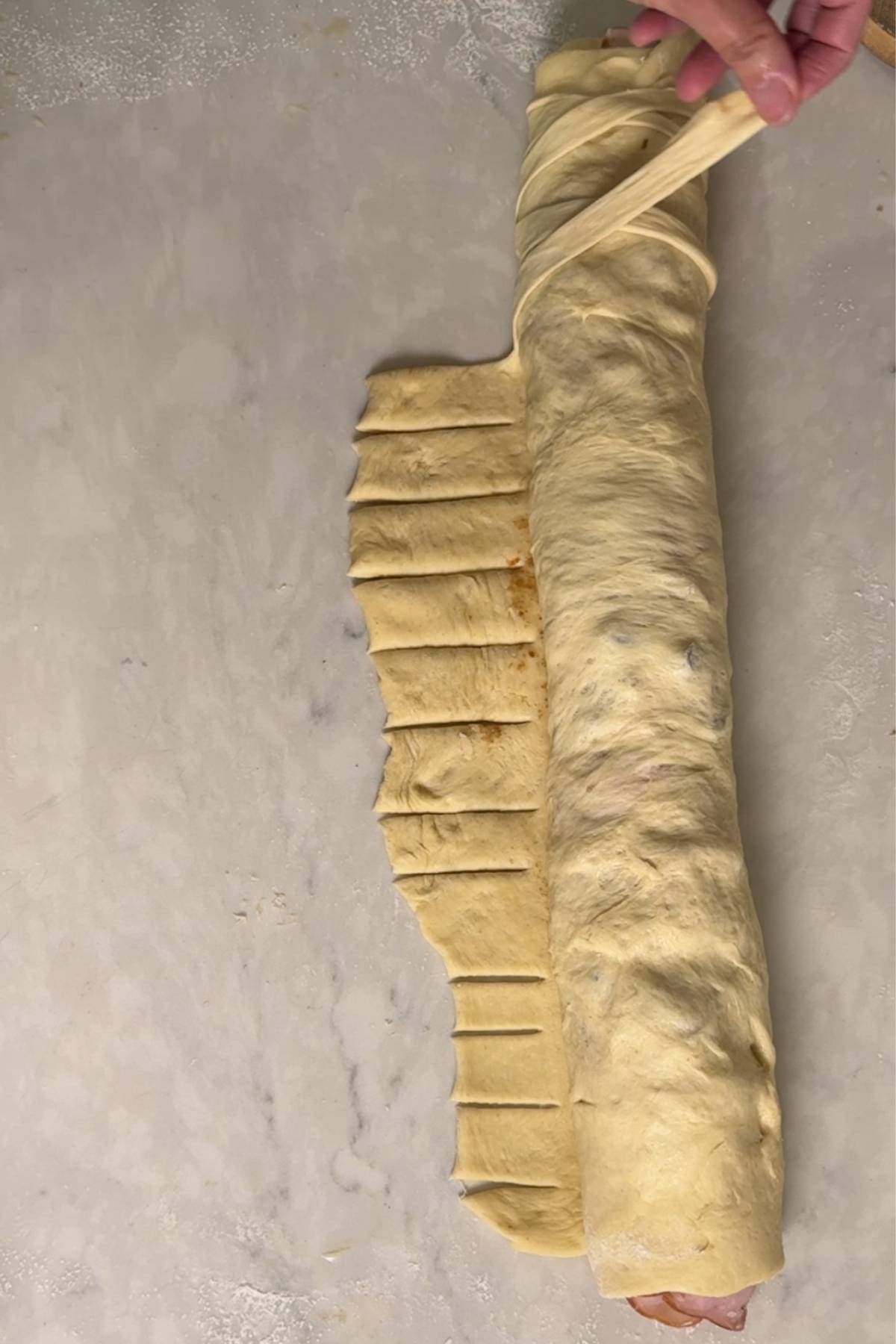 decorating the Sourdough Pan de Jamon with dough strips