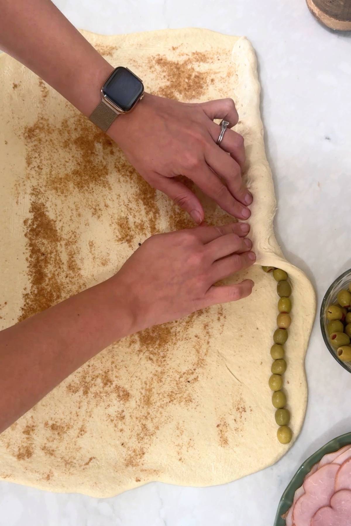 Sourdough Pan de Jamon dough rolled out, spread melted butter and brown sugar and created a olive row