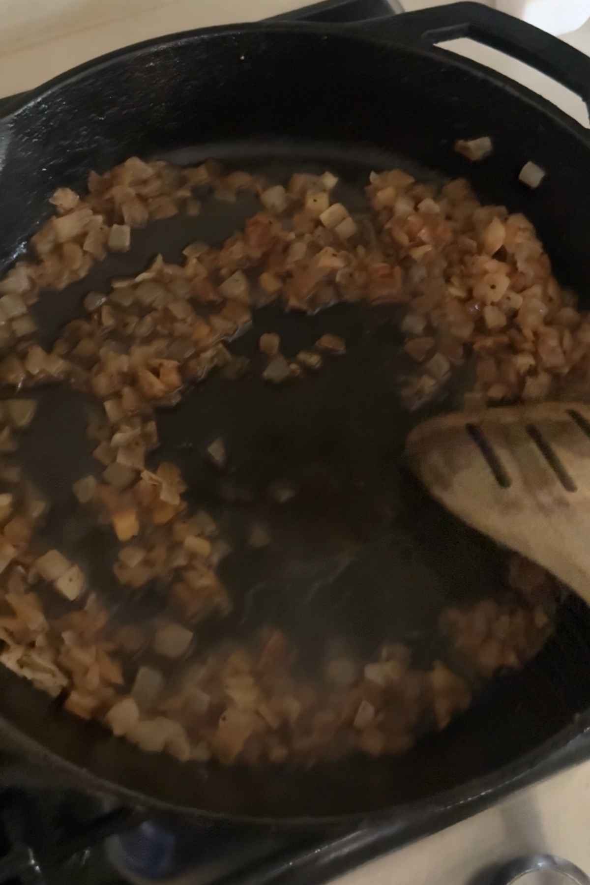 Deglaze the pan with chicken broth and onions
