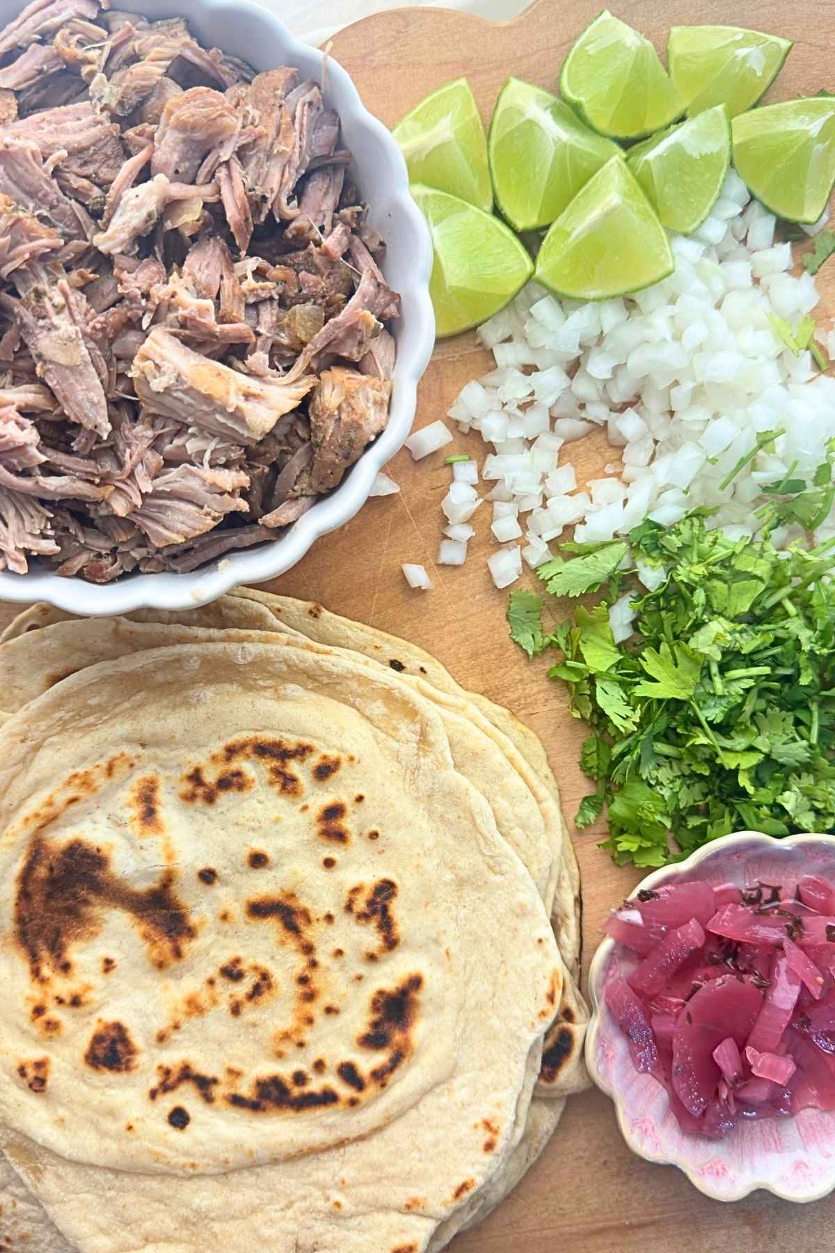 Fill the tortillas with the pork and your favorite toppings