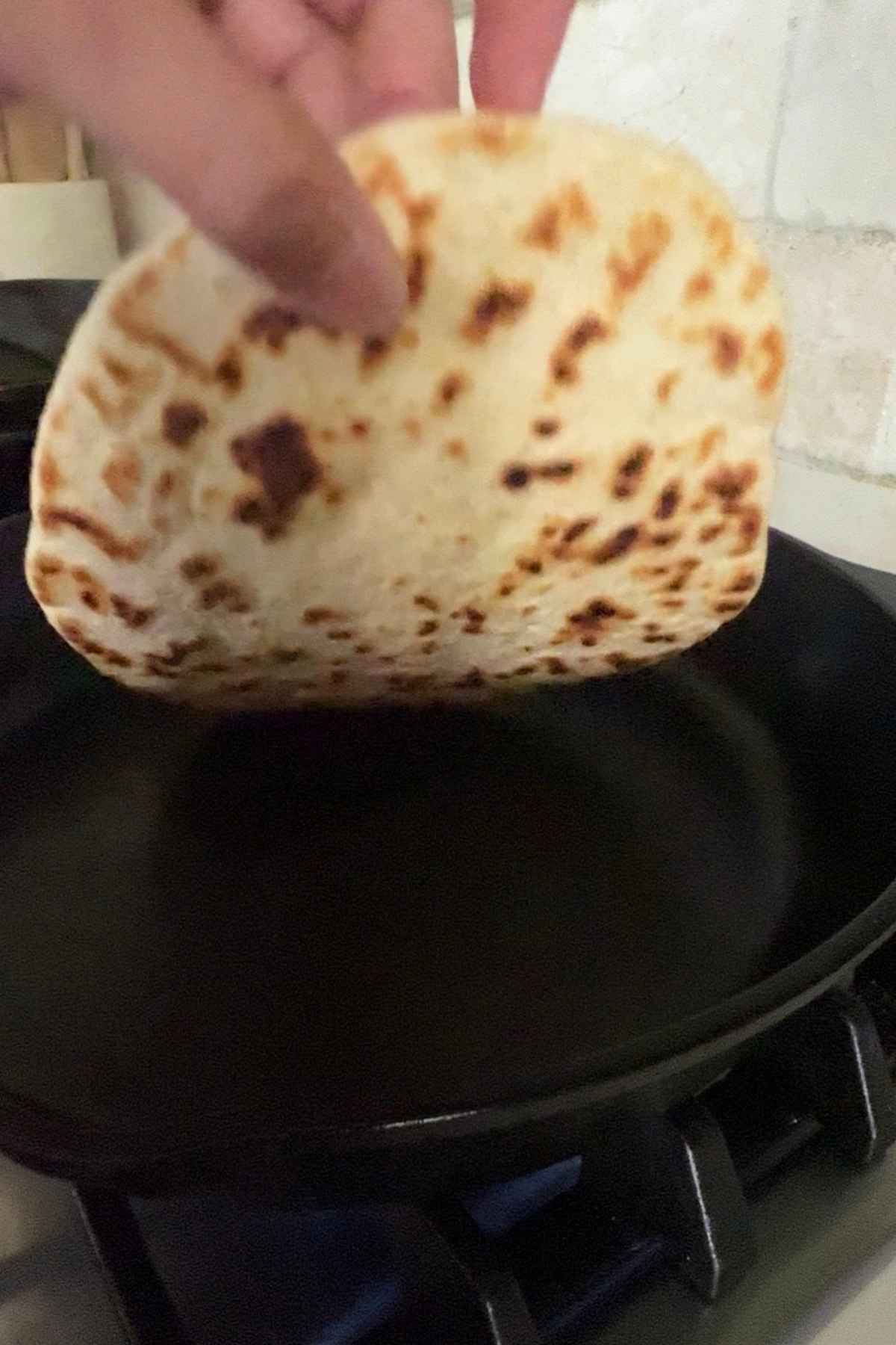 Flip the tortilla and cook the other side