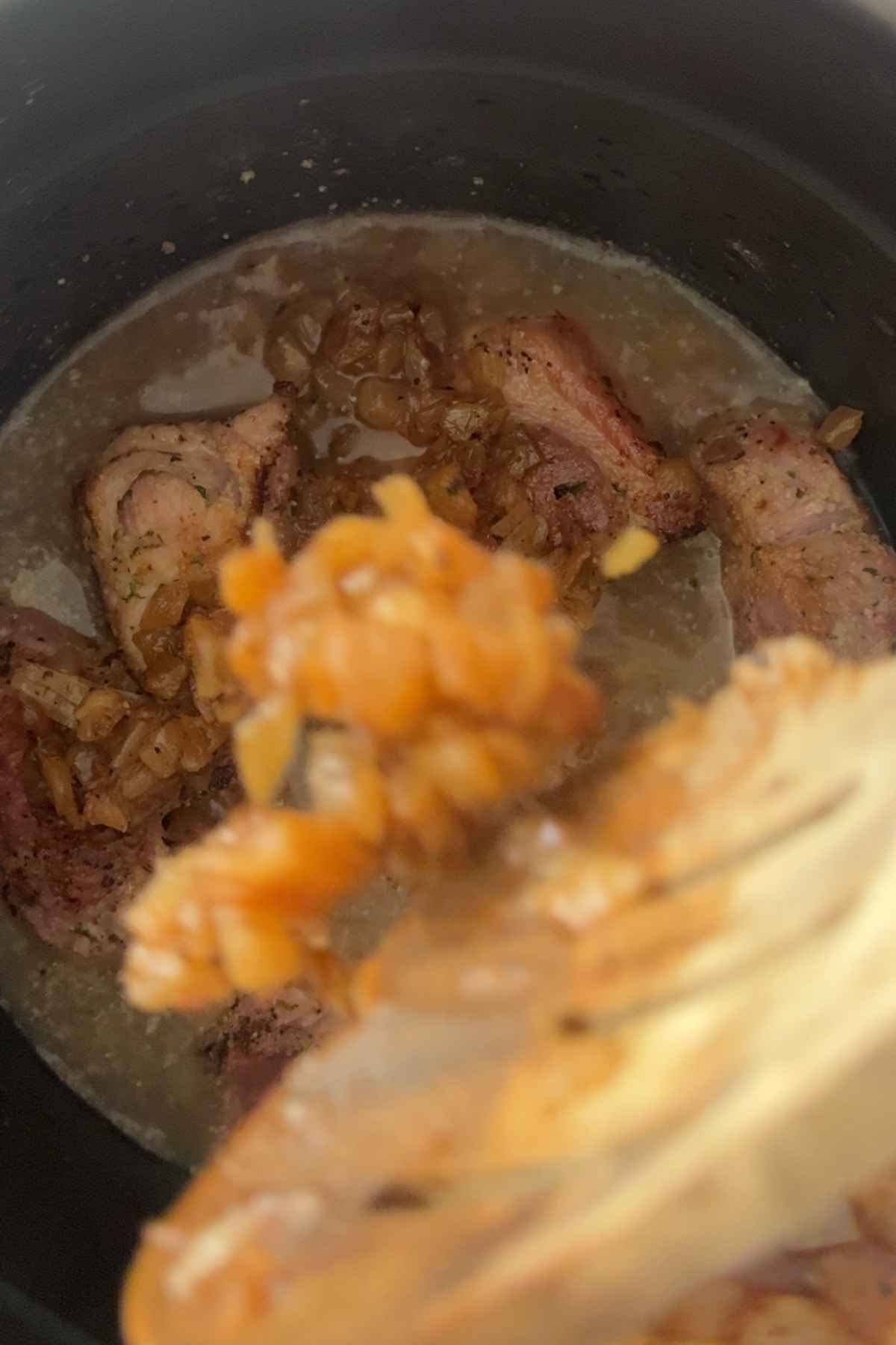 Pressure cook the pork with the broth and onions
