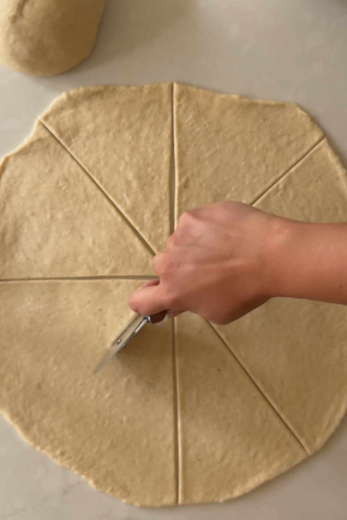 cutting the dough for Cachitos de Jamon - Harm Horns