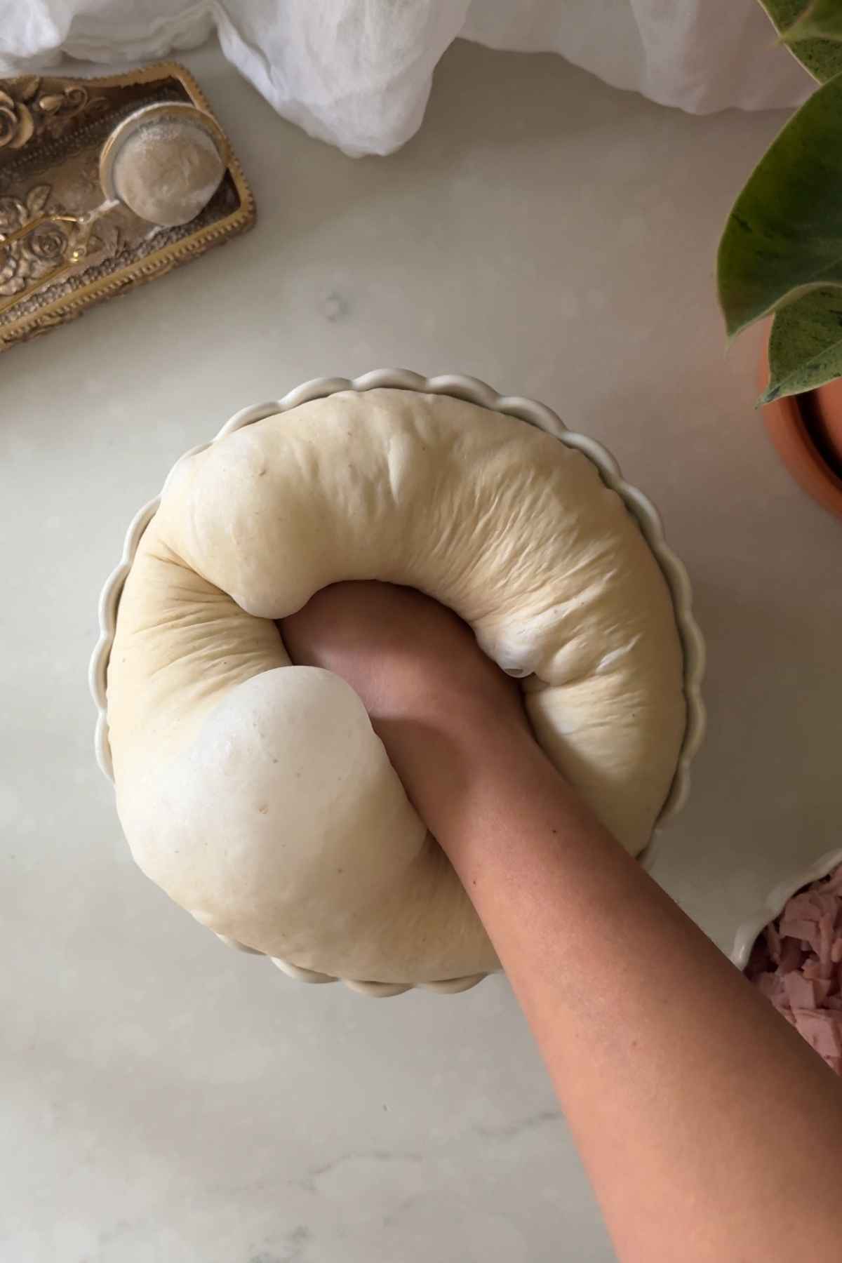 degassing the dough for Cachitos de Jamon - Harm Horns