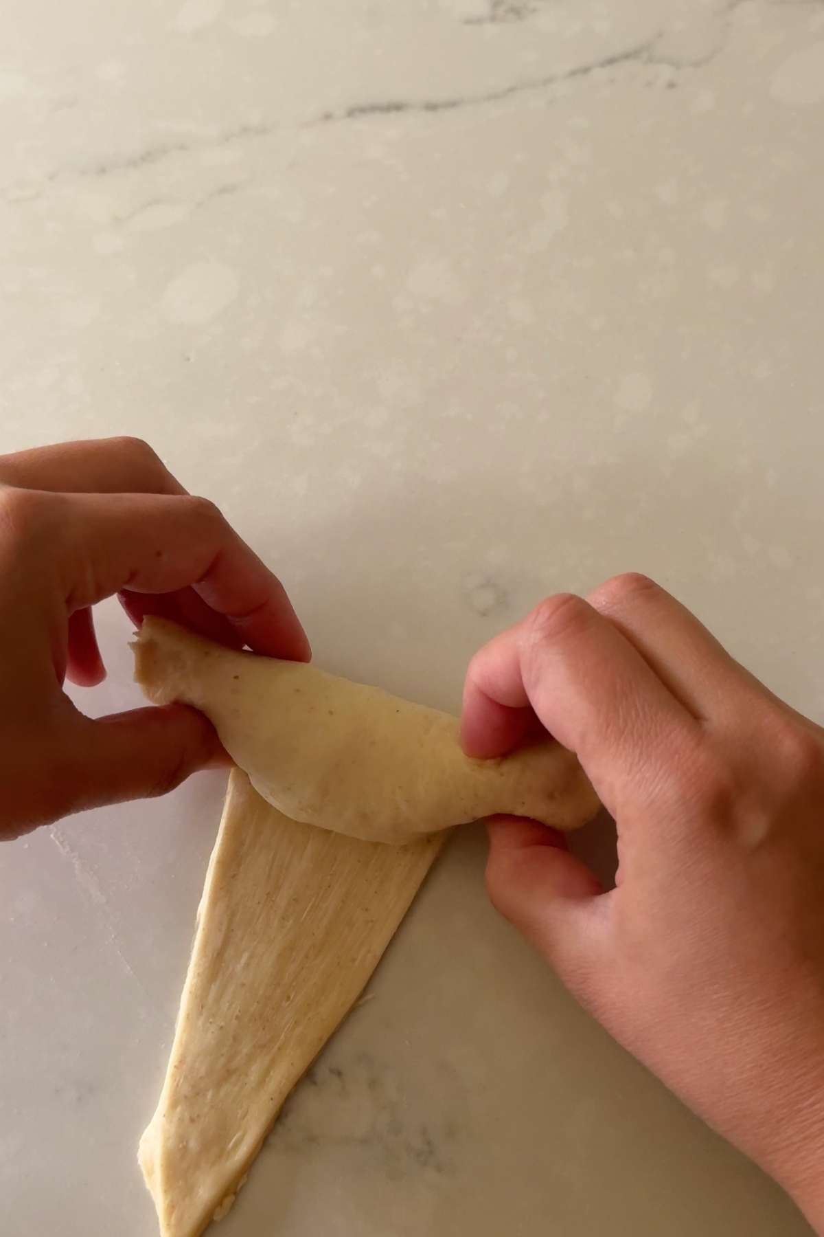 step 2 of rolling Cachitos de Jamon - Harm Horns